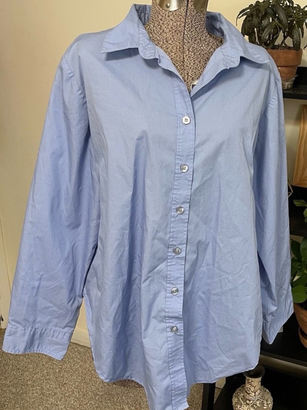 Woman Within Blue Shirt with Pink Label